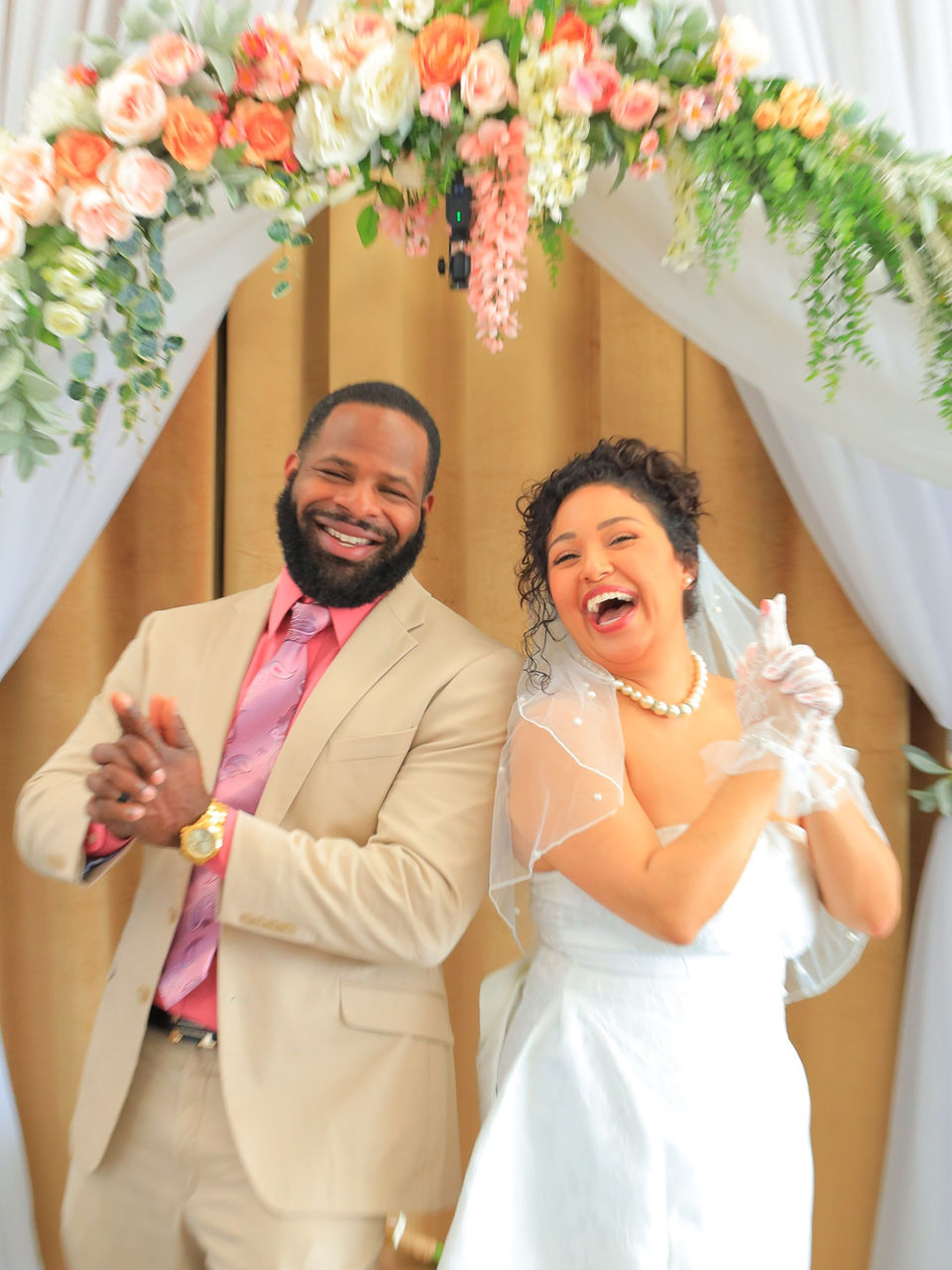 Newly married couple smiling after their ceremony