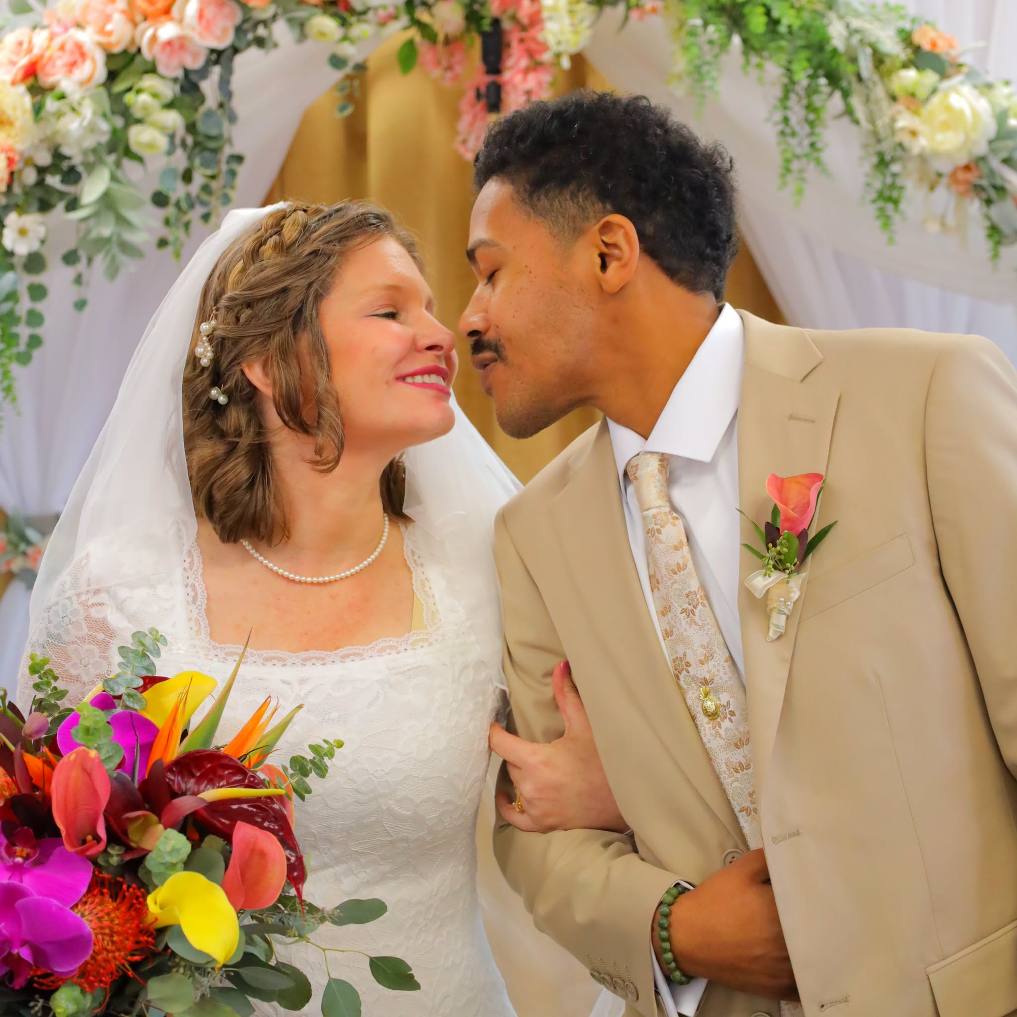 Bride and groom sharing an affectionate moment after their Grand Entrance wedding