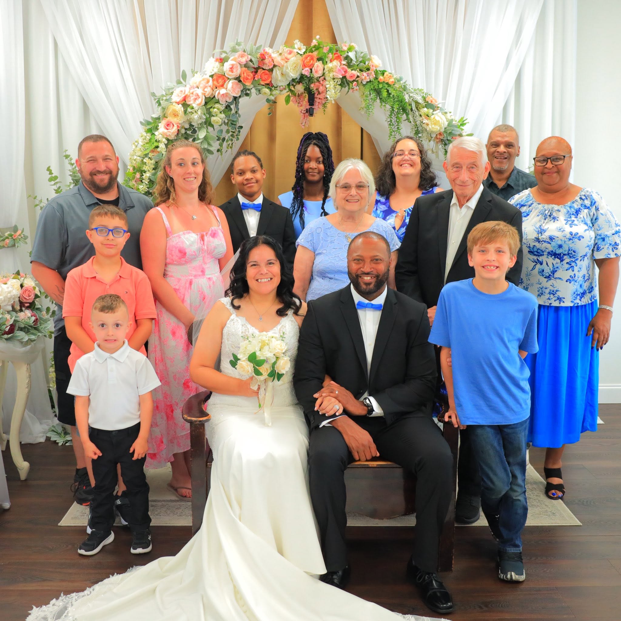 Newly married couple surrounded by family and friends inside the Jacksonville wedding chapel