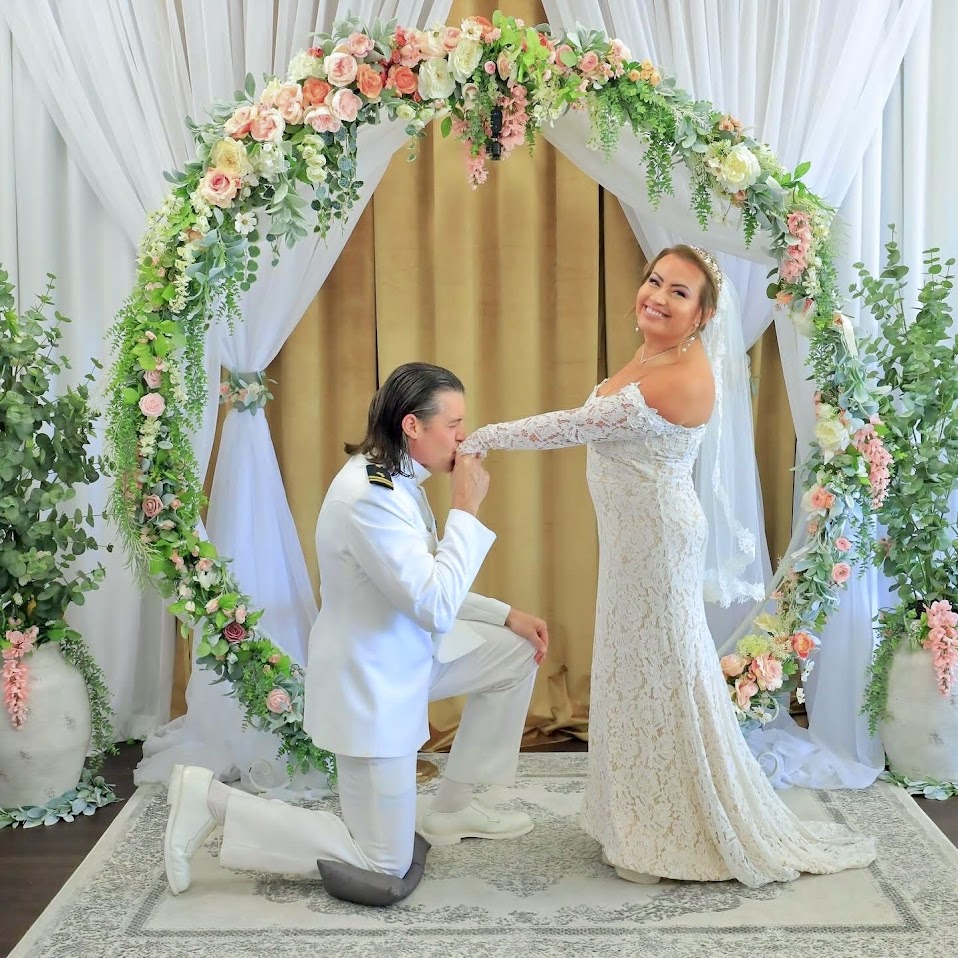 Chaplain Scott with a Grand Entrance wedding couple